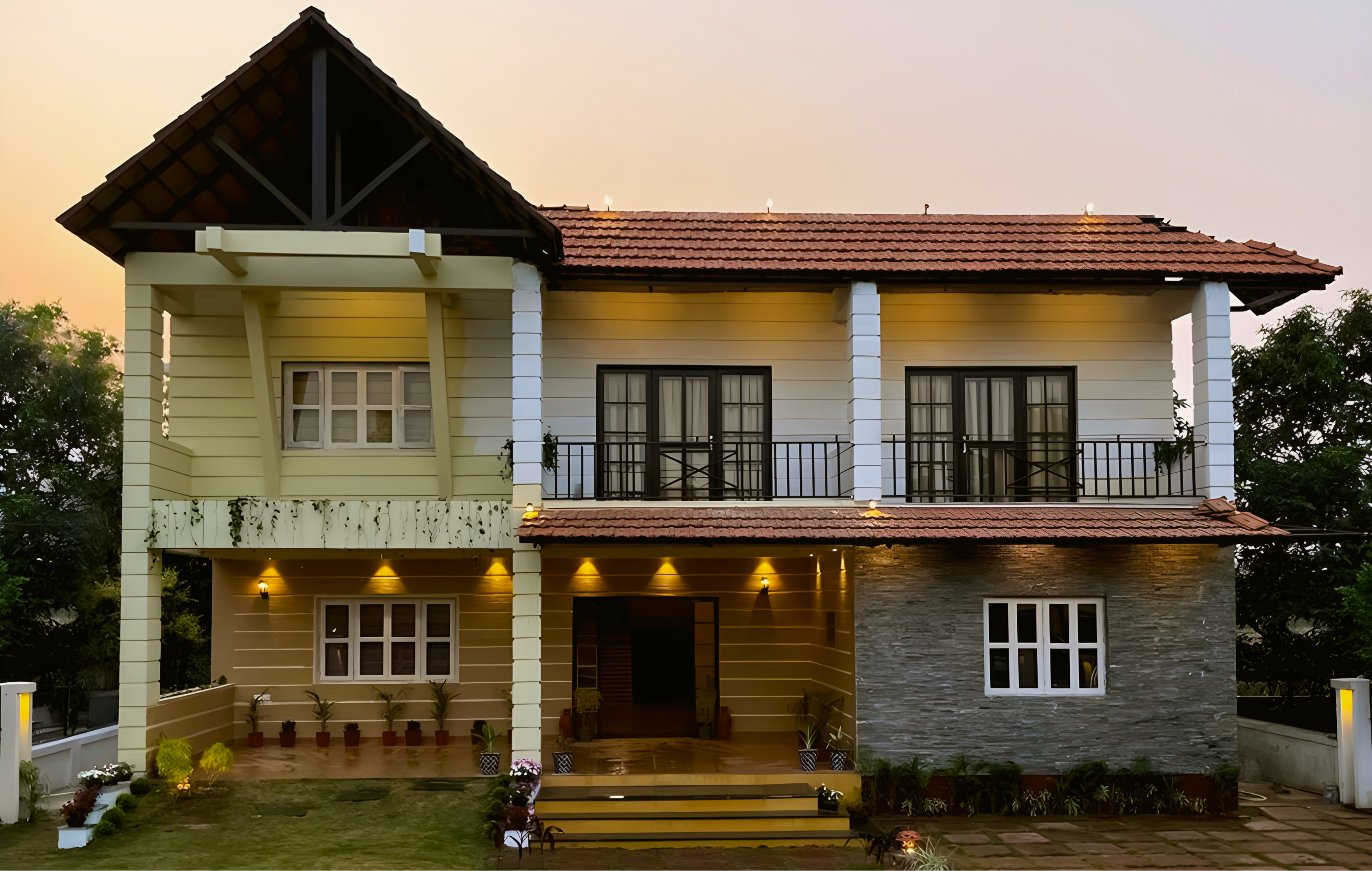 Completed exterior of Abhignan Guest House at dusk, Bengal-inspired residential architecture in Shantiniketan by Char Chala Studio