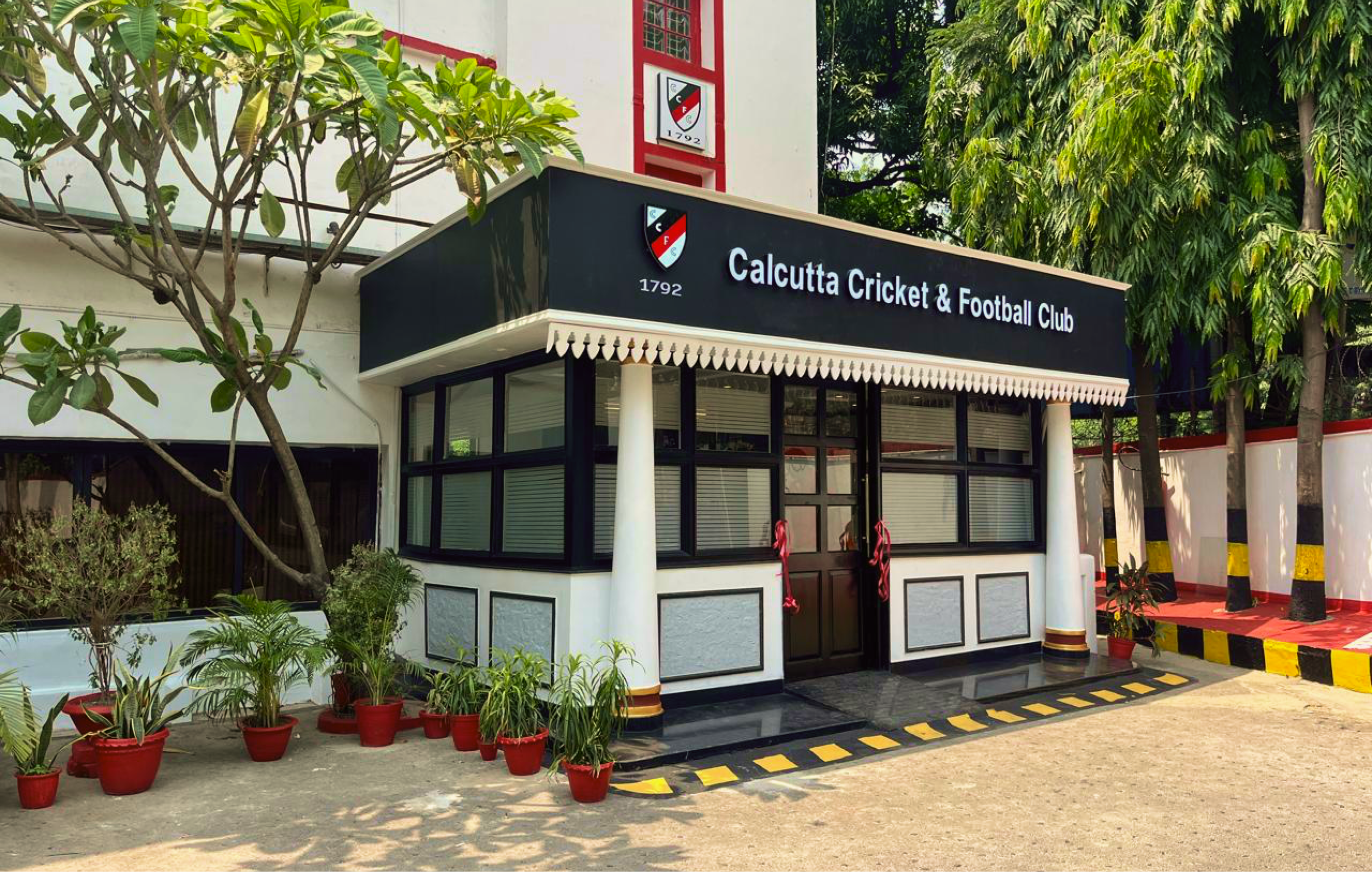 Renovated main reception entrance of Calcutta Cricket and Football Club with black facade and colonial detailing, Kolkata